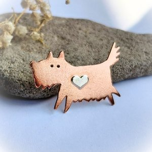 Handcrafted copper scruffy terrier dog brooch with a sterling silver heart
