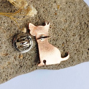 Rear view of the handcrafted copper dog brooch with the brooch pin open