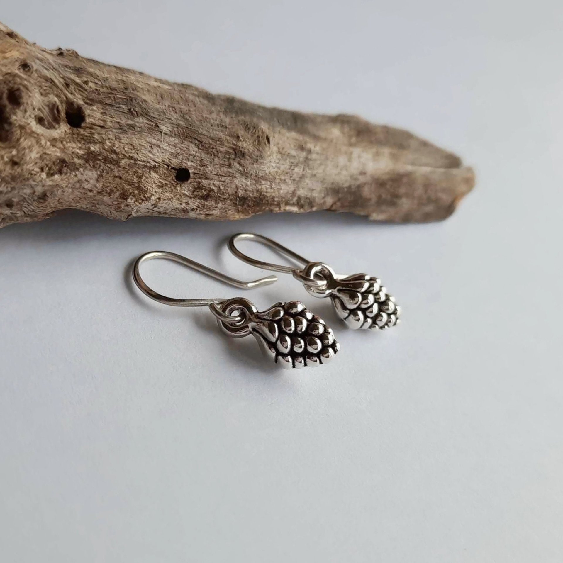 Silver pine cone drop earrings on handmade recycled 925 sterling silver ear wires by The Tiny Tree Frog Jewellery