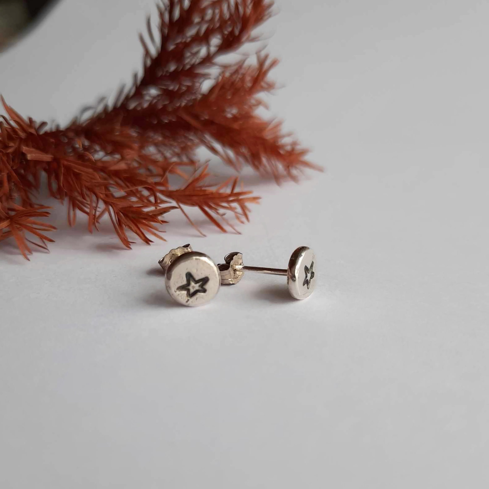 Tiny sterling silver hand stamped star stud earrings, hand made by The Tiny Tree Frog Jewellery