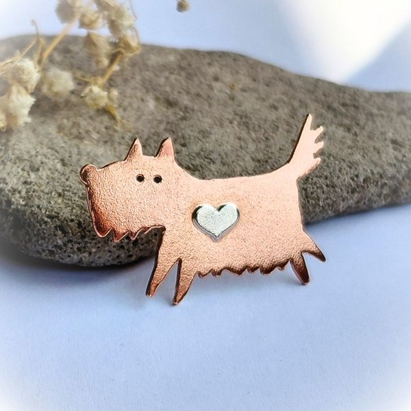 Handcrafted copper scruffy terrier dog brooch with a sterling silver heart